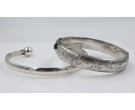 Hallmarked silver snap bangle with engraved decoration, and a 925 silver torq bangle, 53g. UK P&amp;P Group 0 (£6+VAT for the