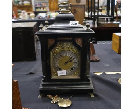 Ebony and brass bracket clock, key and pendulum present, no pendulum hanger, clock is fully wound or over wound. H: 41cm. Not