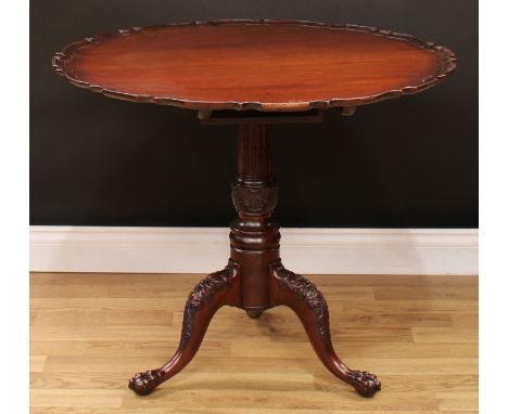 A 19th century mahogany tripod occasional table, shaped circular top with pie-crust edge, stop-fluted acanthus grasped column