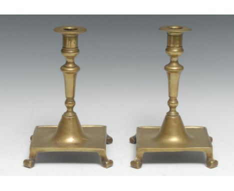 A pair of Spanish brass table candlesticks, knopped pillars, domed socles, square bases, bracket feet, 20cm high, 19th centur