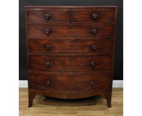 A George IV mahogany bow-front chest, of tall proportions, moulded edge top above two short and four long graduated cockbeade