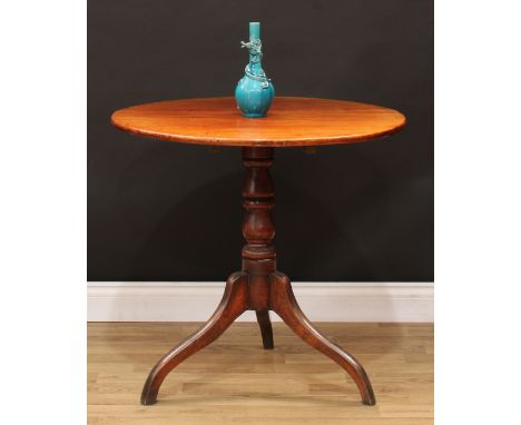 A George III mahogany tripod occasional table, circular tilting top, turned pillar, downswept legs, 73cm high, 75cm diameter,