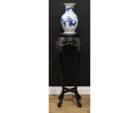 A Chinese padouk wood jardiniere stand, beaded circular top with inset soapstone panel, the apron pierced and carved with blo