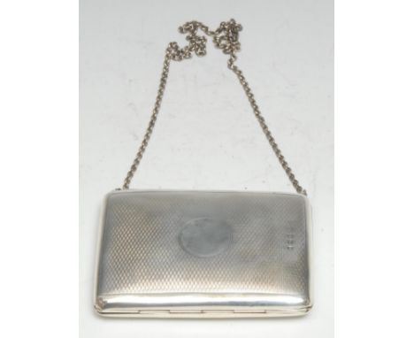 A George V silver rounded rectangular visiting card case, engine turned and centred by a vacant circular cartouche, sprung co