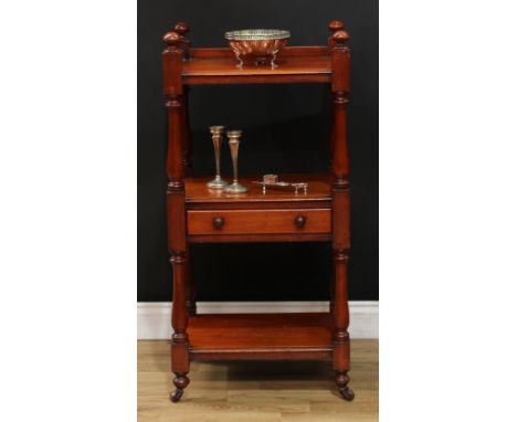 A Victorian mahogany three-tier buffet, of small proportions, three-quarter gallery, turned finials and supports, drawer to f