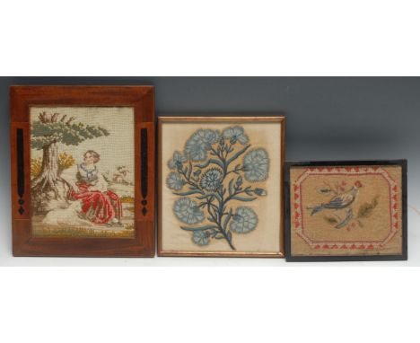 An early 18th century crewel work fragment, depicting stylised carnations, re-laid on linen, 22.5cm x 20.5cm; a George IV nee