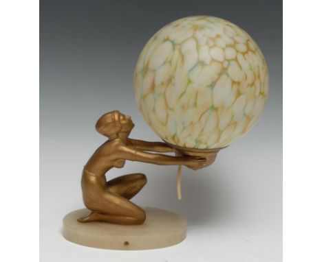 An Art Deco gilt-patinated, glass and onyx table-lamp, as a scantily clad maiden holding a marbled glass shade aloft, 31cm hi