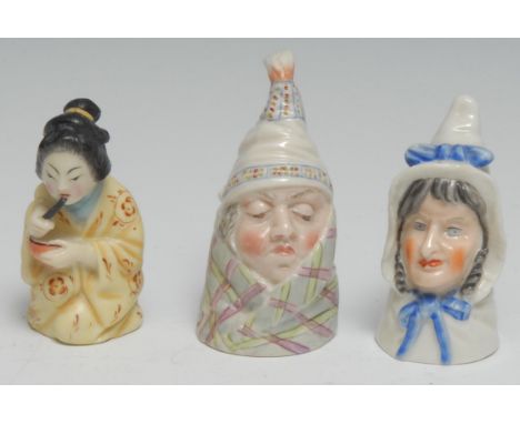A Royal Worcester candlesnuffer, Mr Caudle, wearing a night cap and blanket, lightly coloured, 8cm high, printed crown and ci