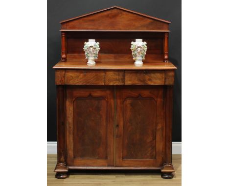 A William IV mahogany chiffonier, pointed-arch superstructure with small bookcase shelf, turned supports, the projecting base
