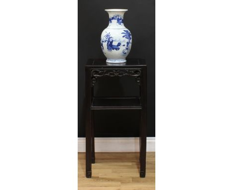 A Chinese hardwood side table or jardiniere stand, rectangular panel top above a shaped and pierced frieze and open undertier