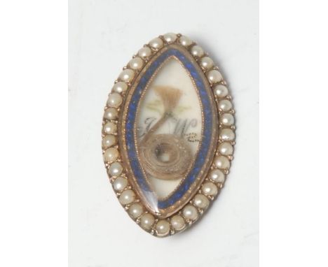 A George III gold coloured metal navette shaped mourning brooch, enclosing a lock of hair and initialled TW, within a blue en