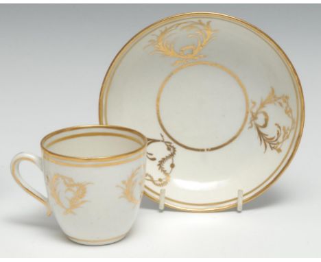 A rare Caughley coffee cup and saucer, gilded with leafy scrolls,   c. 1785-90 