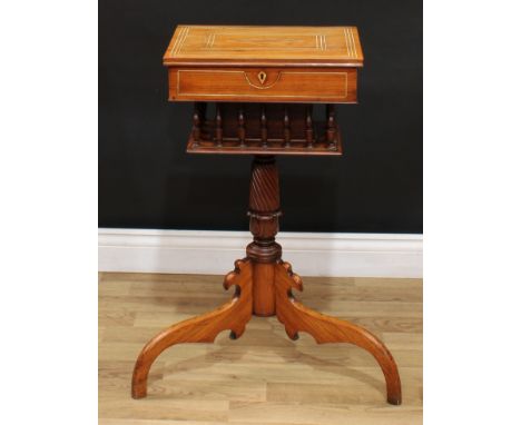 A 19th century Anglo-Indian rosewood tripod work table, hinged top enclosing a fitted interior with lift-out trays and an arr