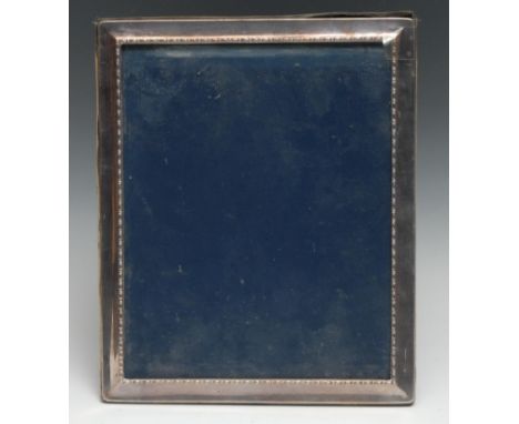 An Elizabeth II silver rectangular easel photograph frame, bead-and-reel border, 29.5cm high, Sheffield 1993 