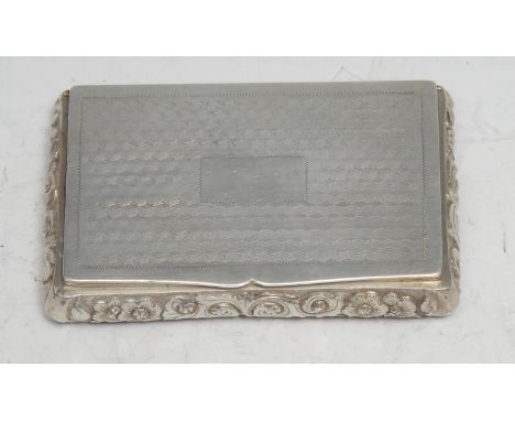 A Chinese China Trade period silver rectangular snuff box, engine turned cover and base, the sides chased with flowers and sc