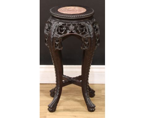 A Chinese hardwood jardiniere stand, circular beaded top with inset soapstone panel, above a shaped frieze pierced and carved