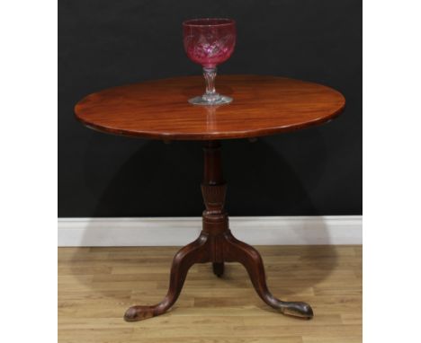 A 19th century mahogany tripod occasional table, circular tilting top, partially wrythen canon-barrel column, cabriole legs, 