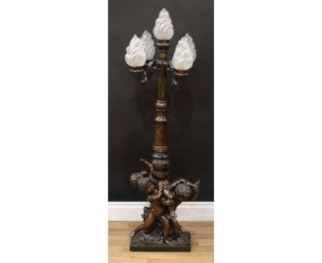A 19th century style bronze floor-standing five-light lamp, flame-pressed glass shades, cylindrical column, the base with fro