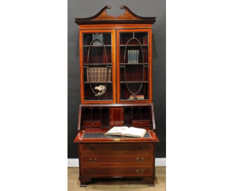 A Sheraton Revival satinwood crossbanded mahogany and marquetry bureau bookcase, by Maple &amp; Co, swan neck pediment above 