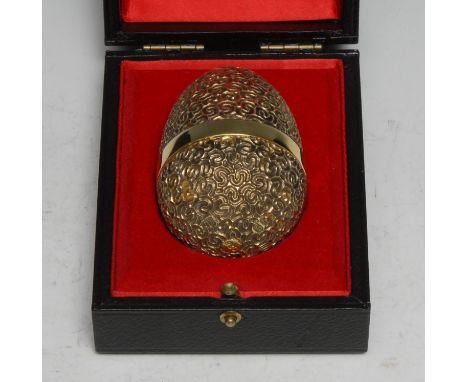 Stuart Devlin (1931 - 2018) - an Elizabeth II silver-gilt and silver surprise egg, Jack in the Box, no.230, 7.5cm long, Londo