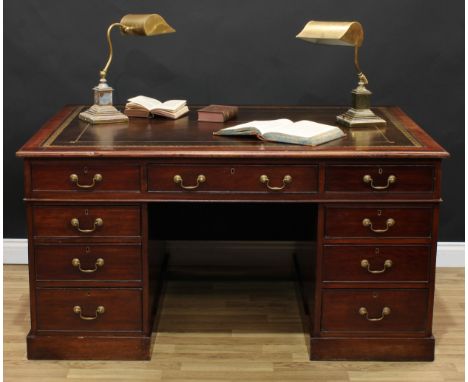 A Victorian mahogany twin pedestal partners' desk, rectangular top with tooled and gilt writing surface above six cockbeaded 