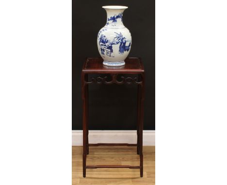 A Chinese hardwood jardiniere stand, panel top above a deep frieze pierced and carved with scrolls, shaped legs and stretcher