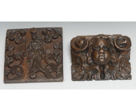 A 17th century oak panel, carved in relief with St Helena and attributes, flanked by flowering scrolling foliage, 13cm wide, 