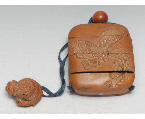 A Japanese four-section boxwood rounded rectangular inro, naturalistically carved in bold relief with butterflies and blossom