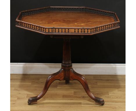 A 19th century mahogany octagonal tripod silver table, tilting top with baluster gallery, birdcage support, fluted pillar, ca