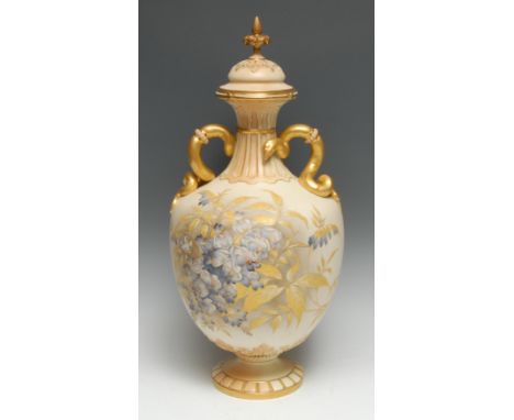 A Royal Worcester two handled pedestal ovoid vase, printed and painted with blue blossom and foliage on a blush ivory ground,