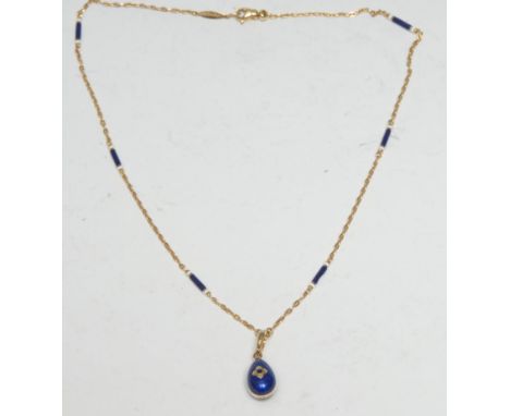 A Faberge limited edition 'egg' shaped enamelled 18ct gold locket pendant, signed, 104/500;  suspended from a Faberge 18ct go