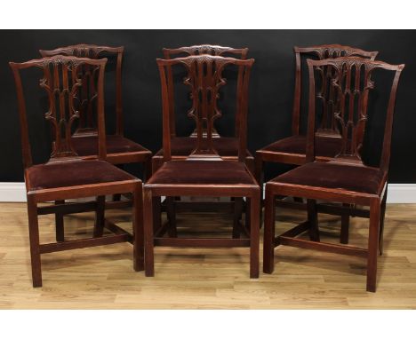 A set of six Chippendale Revival mahogany dining chairs, each with a shaped cresting rail above a shaped and pierced splat, d