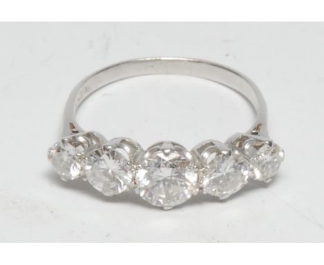 A five stone diamond line ring, linear set with five graduated round brilliant cut diamonds from approx 0.75ct to 0.25ct, tot