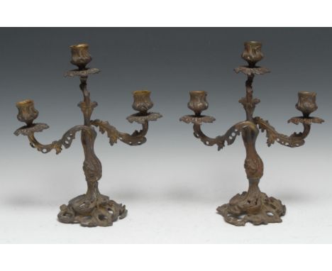 A pair of 19th century Rococo Revival bronze three-light candelabra, cast throughout with scrolling acanthus, 31.5cm high, c.