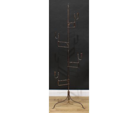 An unusual 19th century steel floor-standing four-section adjustable nip rush light, each section with jaw and candle sconce,