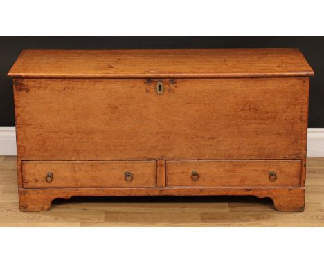 An 18th century oak mule chest, of small proportions, hinged cover, the front with two short drawers, bracket feet, 51cm high