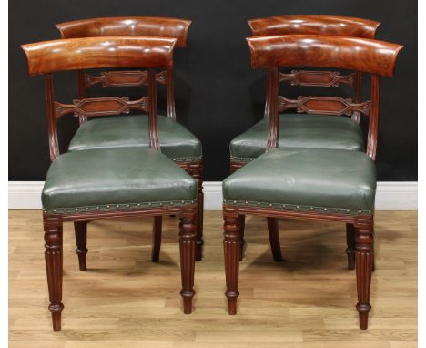 A set of four Regency dining chairs, curved cresting rails, lozenge shaped mid rails, stuffed over seats, reeded tapered cyli