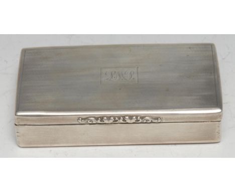 A large Victorian silver rectangular table snuff box, hinged cover with foliate thumbpiece, engine turned and reeded, gilt in