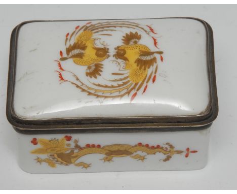 A late 19th Century Meissen rounded rectangular gilt metal mounted porcelain snuff box, the hinged cover decorated with styli