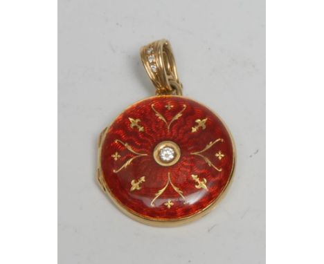 A Faberge limited edition circular red enamel and diamond inset 18ct gold circular locket, round brilliant cut diamond 0.10ct