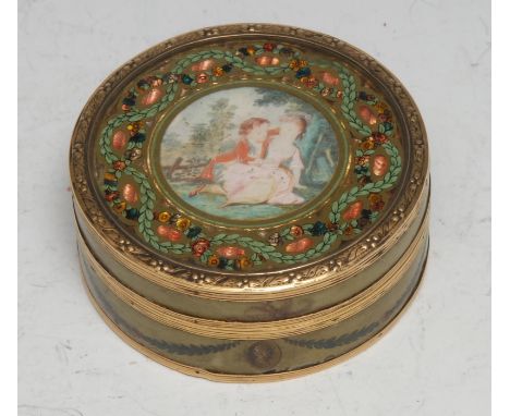 An 18th century French gold mounted vernis martin circular table snuff box, push-fitting cover painted with young suitors, th
