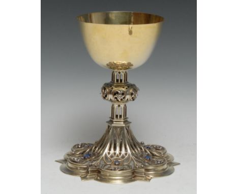 A fine Gothic Revival diamond and sapphire mounted silver-gilt ecclesiastical Communion chalice, the design in the manner of 