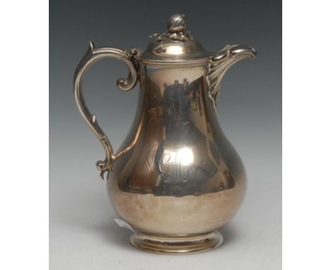 A Victorian silver baluster hot water jug, hinged domed cover with bud finial, scroll handle, 22cm high, Barnards, London 185