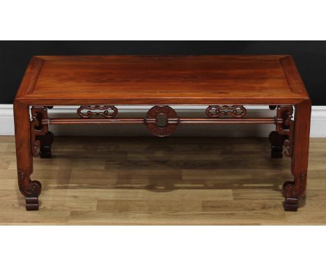 A Chinese hardwood low tea table, rectangular top above a deep frieze pierced and carved with Archaic bi-discs and scrolling 