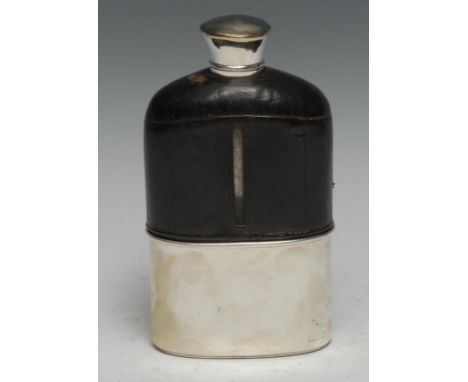 A large Victorian silver mounted and leather clad hip flask, screw-fitting cover, stirrup cup to base, 15.5cm high, retailed 