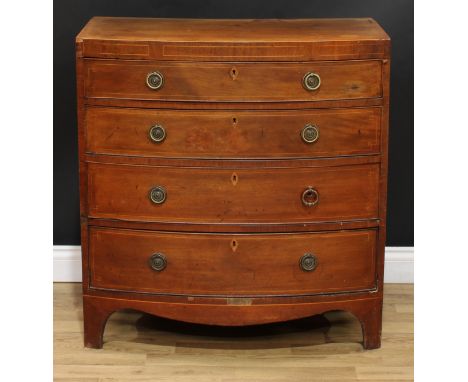 A George IV mahogany bow front chest, flush top above four long graduated cockbeaded drawers, inlaid throughout with boxwood 