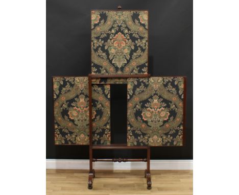 A George/William IV mahogany three-banner extending firescreen, fluted frame applied with draught-turned roundels, turned cyl
