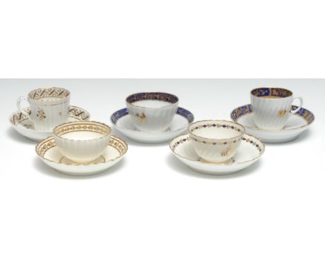 A Worcester spirally fluted tea bowl and saucer, decorated in gilt and cobalt blue, with stylised foliage, crescent mark, c.1