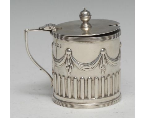 A Victorian Adam Revival silver drum mustard, half-fluted and chased with swags and pendants, hinged cover with knop finial, 