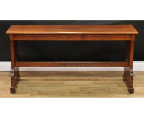 An early 20th century hall bench, rectangular top, shaped end supports, unusual hinged height-adjustment to feet, 66cm high, 